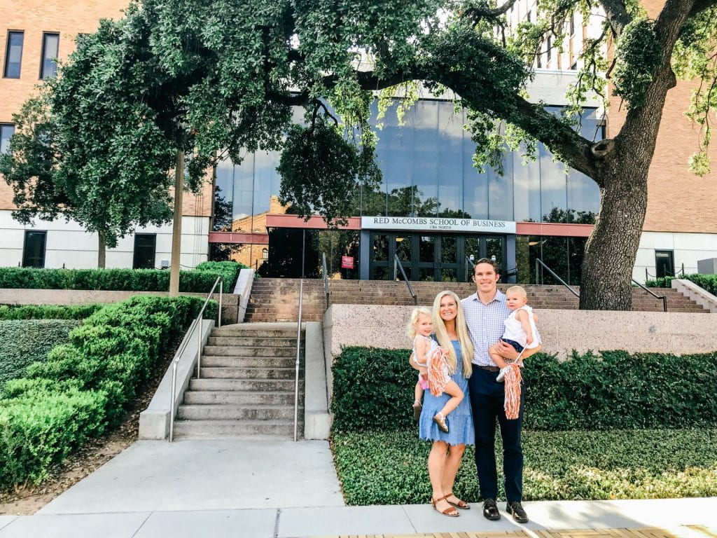 Daniel with his wife and kids outside of the McCombs School of Business building in Austin Texas.