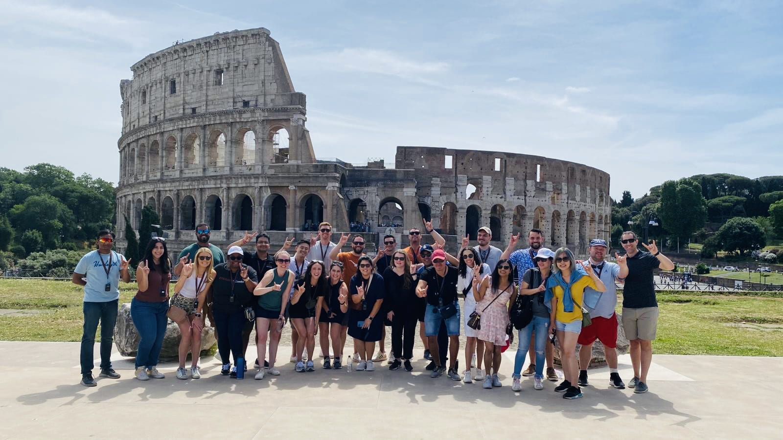 Veronica and other MBA students take a photo outside of the colosseum in Rome, Italy.
